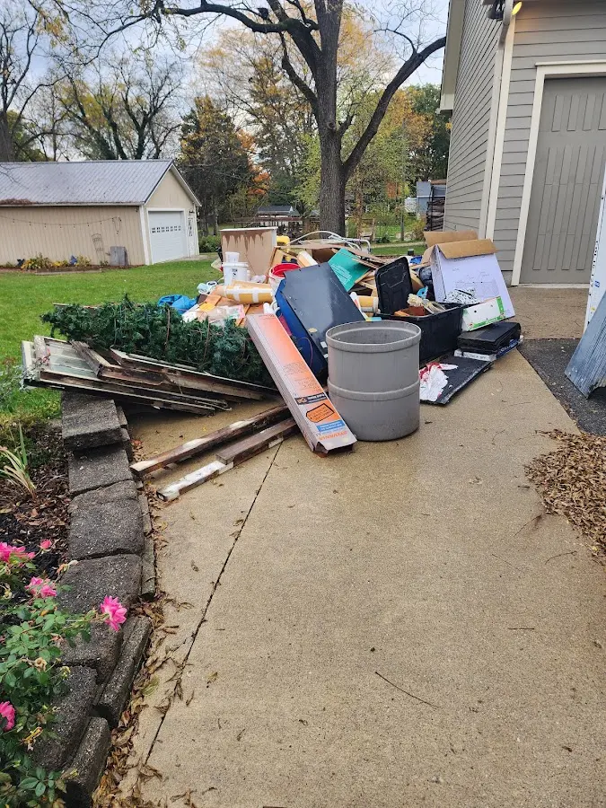 Dumpster being loaded with debris for Commercial Dumpster Rental in Eucalyptus Hills